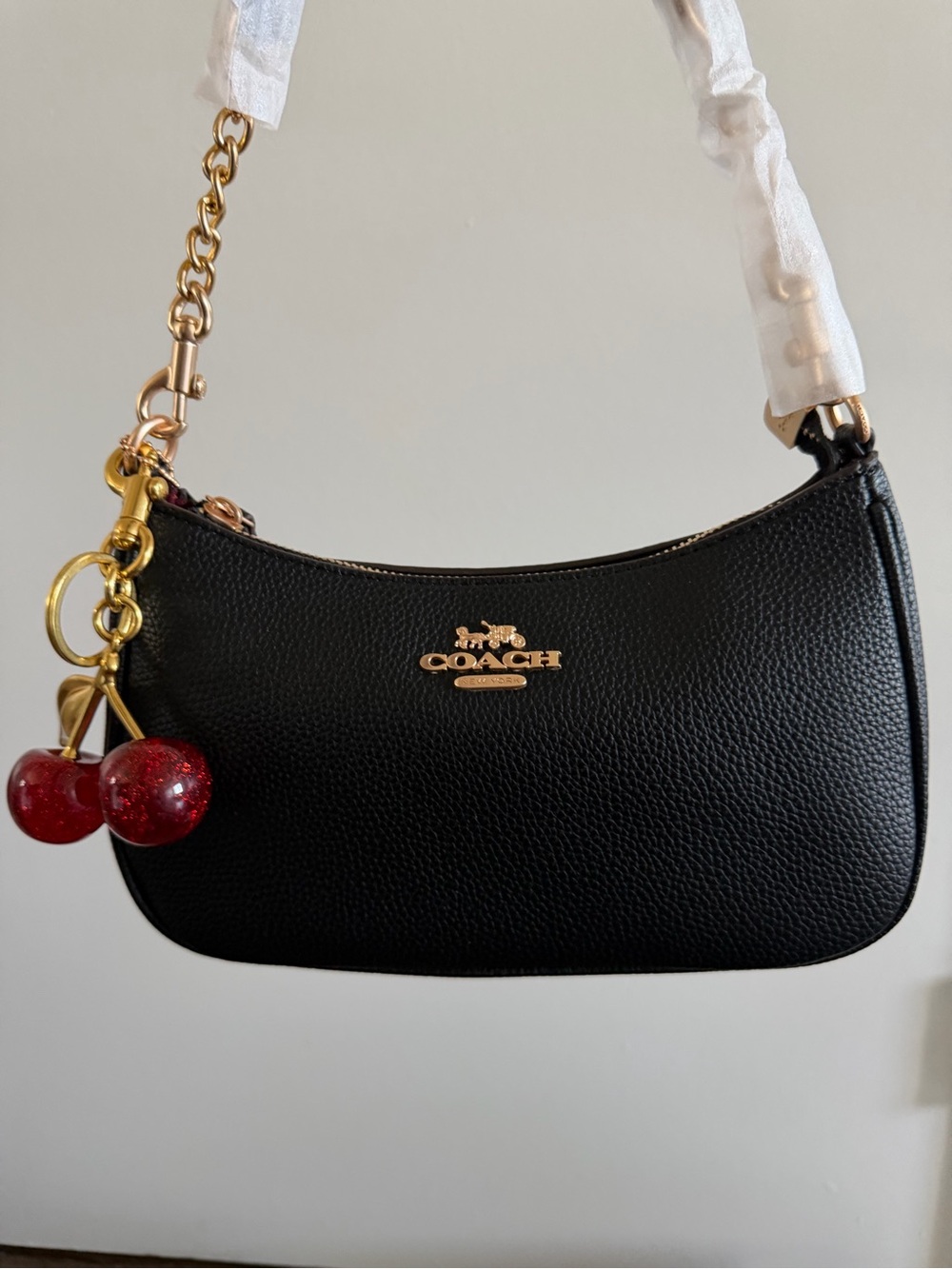 COACH Black Pebbled Leather Mini Shoulder Bag with Red Cherry Charm